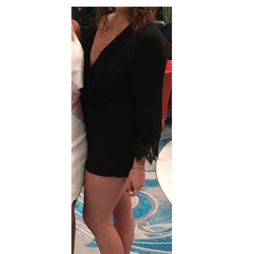 Large black romper with laces wrists